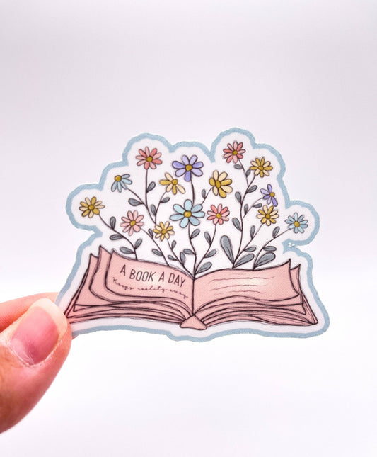 A Book a Day Keeps Reality Away Sticker by Big Chair Dreams